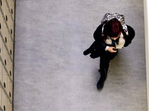 Overhead view of a student walking down a hallway