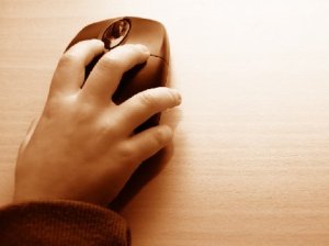 Child's hand on a computer mouse