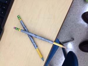 Two duct taped pencils
