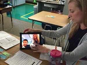 Teacher watching herself on video
