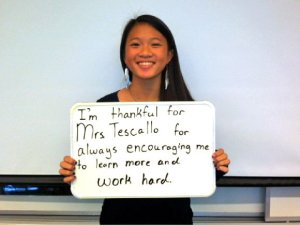 Student thanking teacher with note