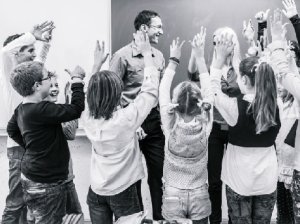 Happy Students Around a Teacher