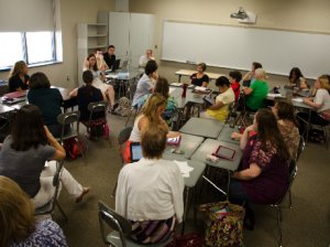 Teachers Sitting in Classroom Talking