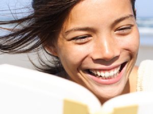 A happy teacher reading