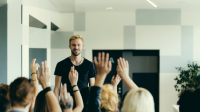 Photo of teacher at the front of the class