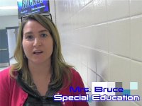 A female teacher standing in a school hallway. The words Mrs. Bruce and Special Education are imposed on the photo. 