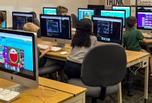 Kids in a classroom use a variety of programs to practice coding.