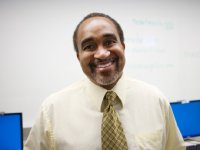 Standing, smiling man in tie