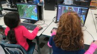 Kids explore Minecraft in a class.