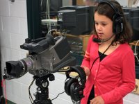 Young girl with video camera.