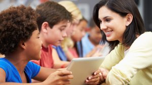 Teacher and student smiling at each other