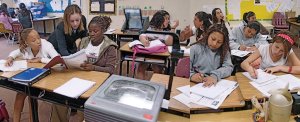 Girls working at their desks in class