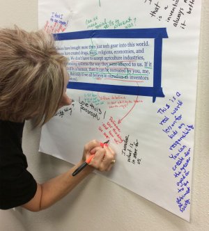 photograph of a teacher writing on a collaborative document