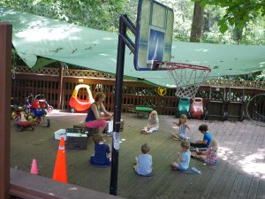 Students attend class in an outdoor classroom at Children First school