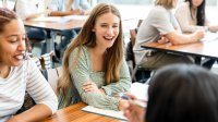 Small group of high school students working together in a classroom