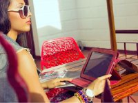 Woman sitting outside with her tablet