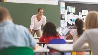 Elementary school teacher speaking to students