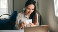 Teacher creating remote learning lesson at home with her laptop