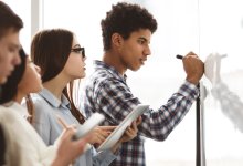 formative assessment grade High school students work together at whiteboard