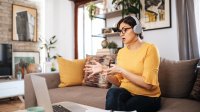 Woman at home speaking on zoom call.