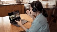 Woman at home on video conference call