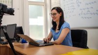 Teacher conducts class remotely while in her classroom