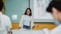 High school student gives lecture in front of class