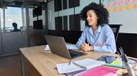 Educator conducts a video chat in her office