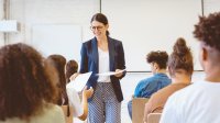feedback to an essay High school teacher handing papers back to teachers