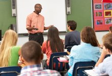 Teacher speaking in front of his class