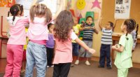 Kids dancing in a circle
