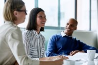 Teachers and administrators talking in a professional development meeting