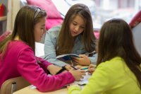 Three students working together on a project