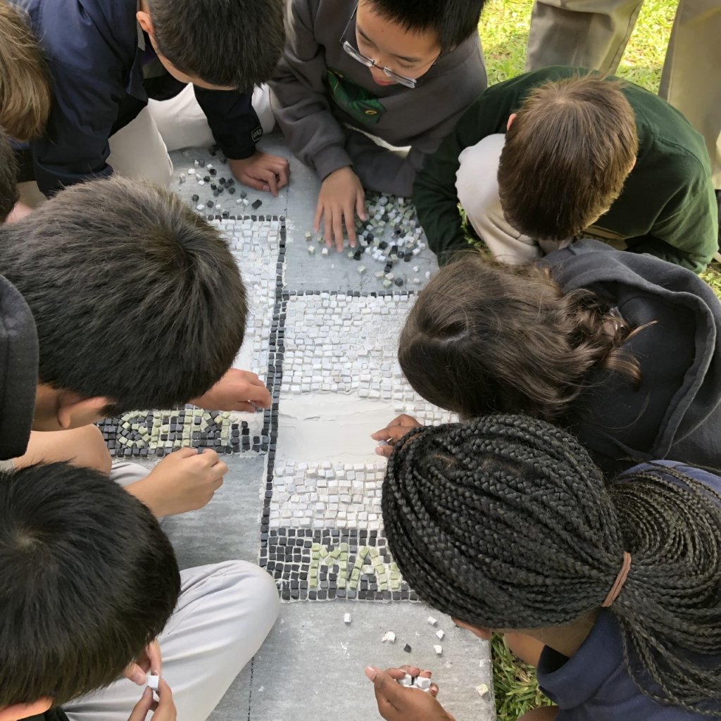 Photo of students doing mosaic work