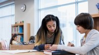 Elementary school students work together