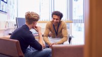 Teacher speaks high school student