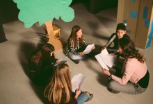 Middle school students rehearsing for school play in drama class