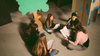Middle school students rehearsing for school play in drama class