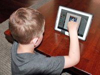 Boy watching a video on a tablet