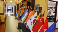 Flags from around the World lining a school hallway