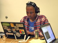 photo of a student coding on a laptop