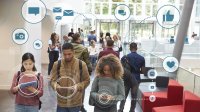 Photo of teens walking while holding smartphones or tablet computers, with social media icons overlaid on the image