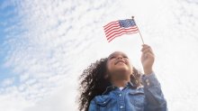 Girl holding an American flag.