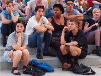 A photo of a group of teens hanging out.