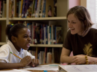 photo of a student and teacher sharing a laugh