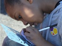 photo of a girl working with pen and ink