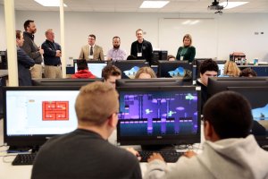 Tour guests observe a video game development class at West Leyden High School.