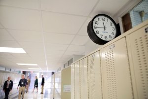 Tour guests walk the hallways of West Leyden High School.