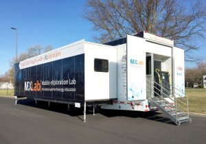 The exterior of a double-expandable trailer that says, 'Mobile exploration lab for science and technology education.'