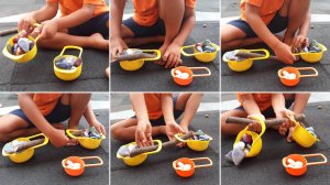 Gird of a child playing with stones and sticks